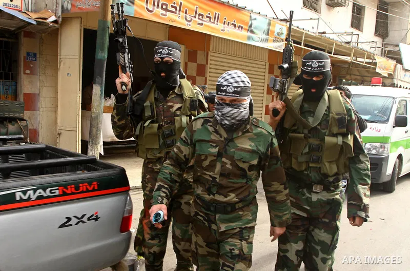 Masked Palestinian militants of a group affiliated with the Al Aqsa Martyrs Brigades attend a press conference in Gaza City, Thursday, Jan. 27, 2011. Members of the tiny offshoot of the now largely defunct militant group...