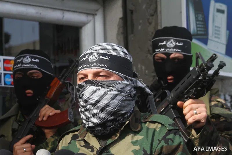 Palestinian militants from the al-Aqsa Martyrs Brigades give a press conference in which they denounced the alleged major concessions made by rival Palestinian leaders during peace talks with Israel, on January 27, 2011...