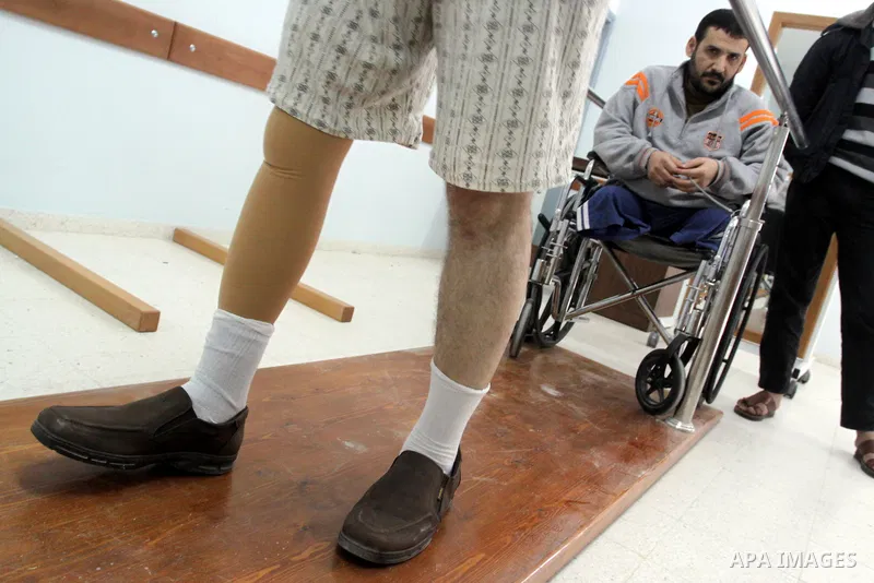 Palestinian victims of Gaza 2008/2009 war test out their new prosthetic legs during the opening of a new prosthetics and paralysis center in coordination between the International Committee of Red Cross and the Municipal...