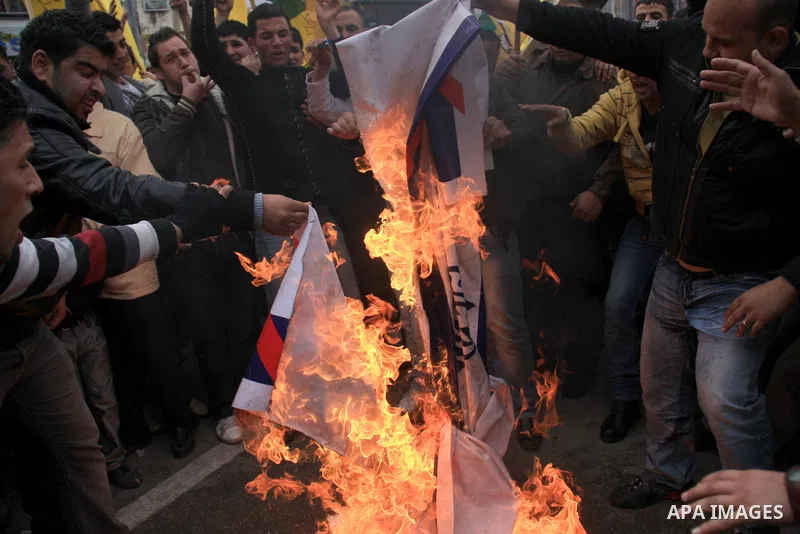 Palestinians burn Al-Jazeera logos during a rally in the West Bank City of Nablus , to protest against Al-Jazeera TV Channel on 27 January 2011. Al-Jazeera, a Qatar-based Arab satellite station, this week published excer...