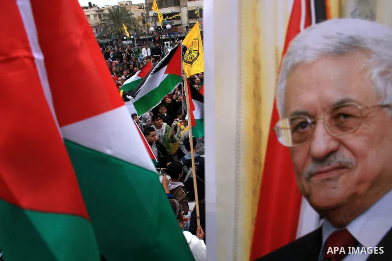 Palestinians hold Fatah flags and national flags during a rally in the West Bank City of Nablus , to protest against Al-Jazeera TV Channel on 27 January 2011. Al-Jazeera, a Qatar-based Arab satellite station, this week p...