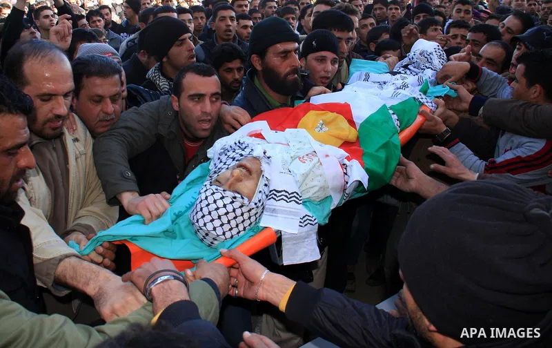 Palestinians carry the body of Uday Qadous, 18, who was shot and killed Thursday in the village of Iraq Burin, during his funeral at in the West Bank city of Nablus, Friday Jan. 28, 2011. Israeli police spokesman Micky R...