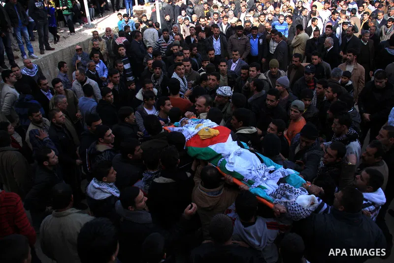 Palestinians carry the body of Uday Qadous, 18, who was shot and killed Thursday in the village of Iraq Burin, during his funeral at in the West Bank city of Nablus, Friday Jan. 28, 2011. Israeli police spokesman Micky R...