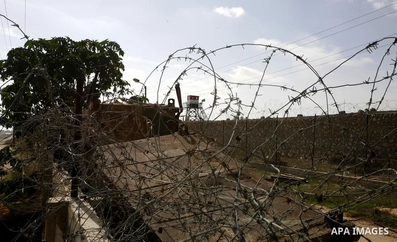 An Egyptian control tower is seen behind barbed wire at the Egyptian border with the Gaza Strip in the city of Rafah, southern Gaza Strip on, 28 January 2011. The Egyptian authorities intensified security measures on the...