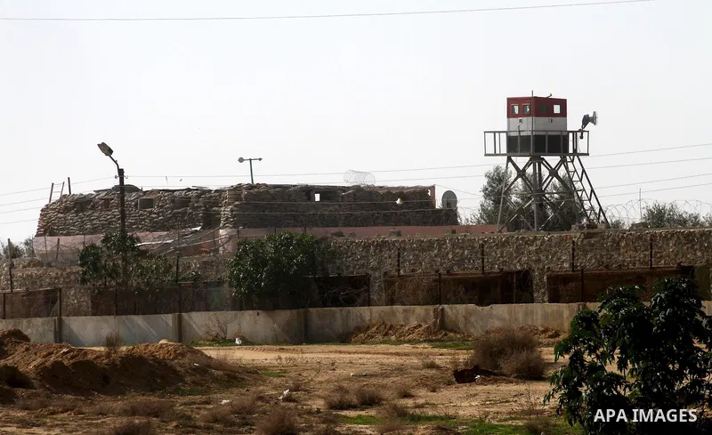 An Egyptian control tower is seen behind barbed wire at the Egyptian border with the Gaza Strip in the city of Rafah, southern Gaza Strip on, 28 January 2011. The Egyptian authorities intensified security measures on the...