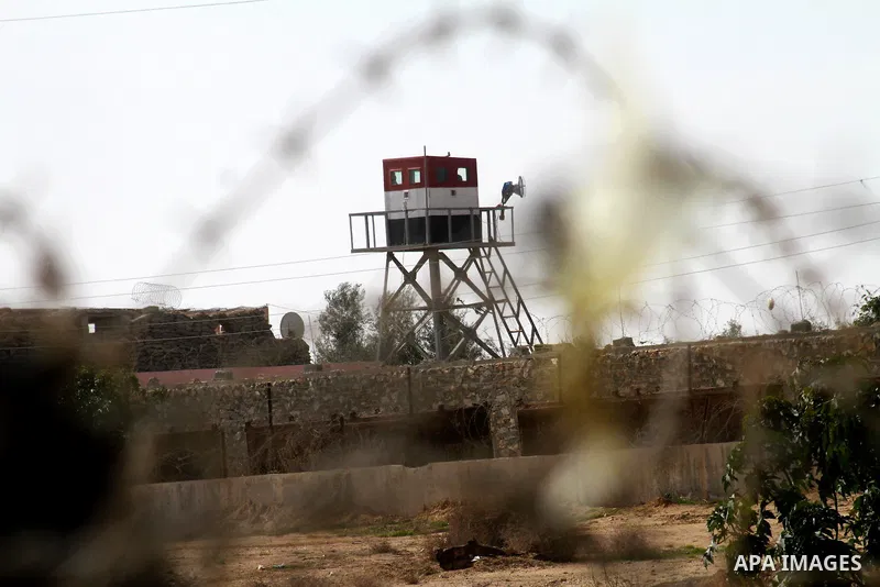 An Egyptian control tower is seen behind barbed wire at the Egyptian border with the Gaza Strip in the city of Rafah, southern Gaza Strip on, 28 January 2011. The Egyptian authorities intensified security measures on the...