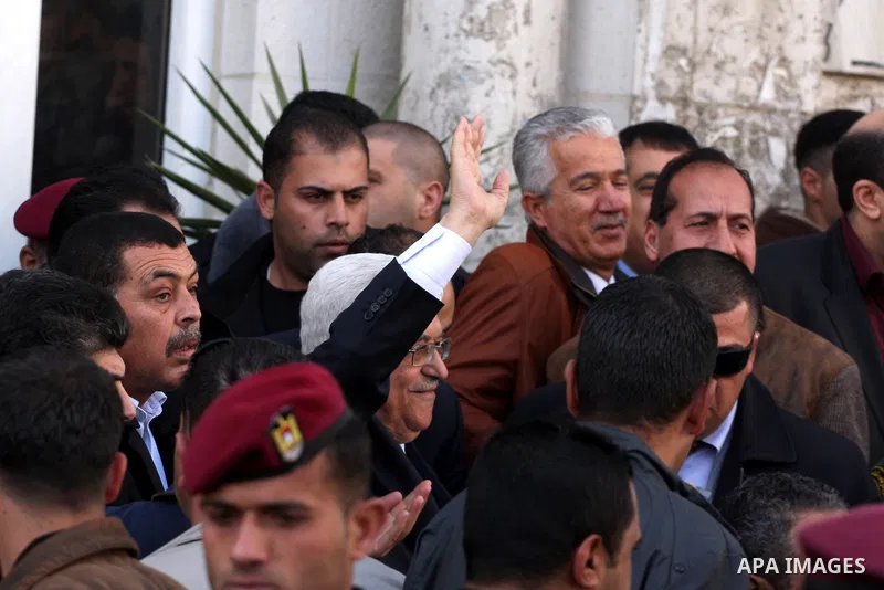 Palestinian President Mahmoud Abbas arrives to attend Friday prayers at Jamal Abdel Nasser mosque in the West Bank city of Ramallah on Jan. 28,2011. photo by Issam Rimawi