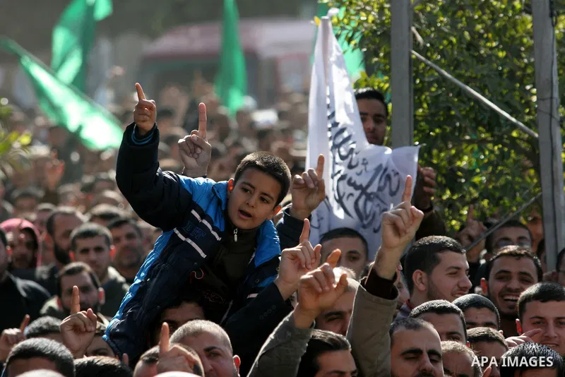 Palestinian Hamas activists protest against Palestinian President Mahmoud Abbas and his government following a recent broadcast by Al-Jazeera reportedly linking him to making broad concessions to Israel in peace talks, i...