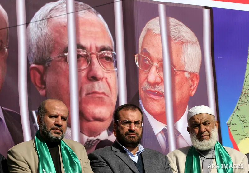 Palestinian Hamas activists protest against Palestinian President Mahmoud Abbas and his government following a recent broadcast by Al-Jazeera reportedly linking him to making broad concessions to Israel in peace talks, i...