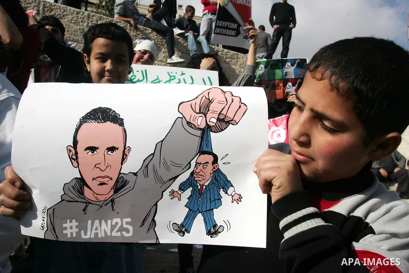 Palestinian demonstrators take part to show the solidarity with protestors in Egypt and Tunisia at Damascus Gate, outside Jerusalems' Old City, Friday, Jan. 28, 2011. Photo by Mahfouz Abu Turk