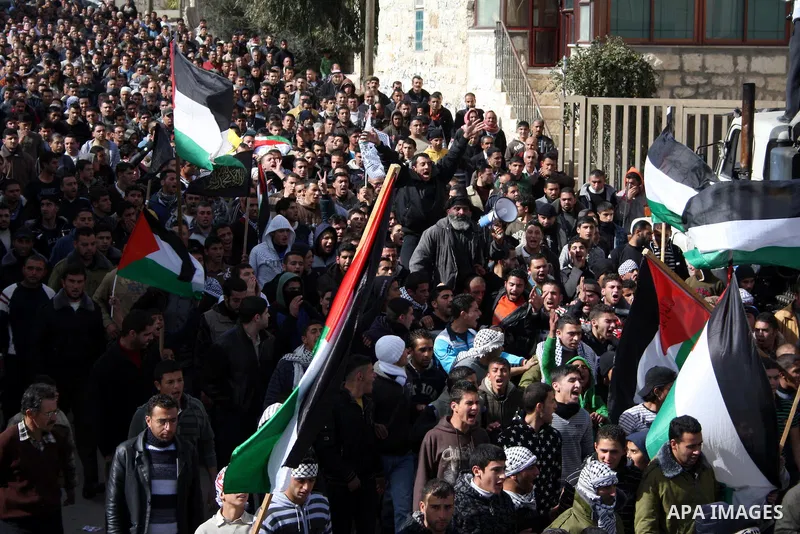 Palestinians carry the body of Youssef Ekhaleil during his funeral in the West Bank village of Beit Omar, near Hebron, Saturday, Jan. 29, 2011. Ekhaleil died from wounds sustained during a clash with settlers on Friday P...