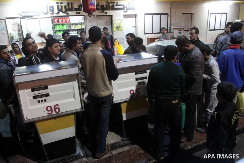 Palestinians gather at a petrol station in Gaza city on Jan 29,2011, as Palestinians rush to petrol stations for fear of being cut off petrol which smuggled from tunnels between Gaza and Egypt as a result of the developm...