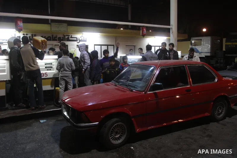 Palestinians gather at a petrol station in Gaza city on Jan 29,2011, as Palestinians rush to petrol stations for fear of being cut off petrol which smuggled from tunnels between Gaza and Egypt as a result of the developm...