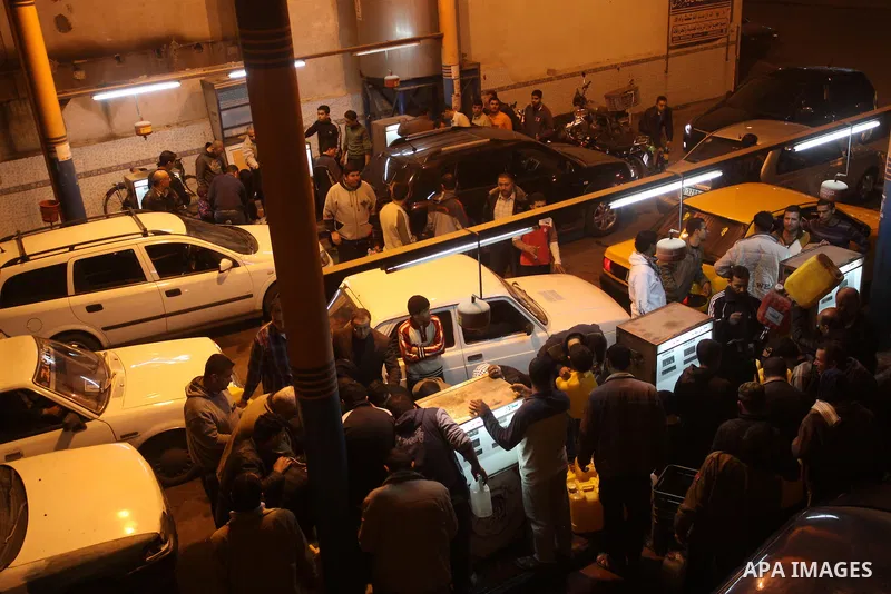 Palestinians gather at a petrol station in Gaza city on Jan 29,2011, as Palestinians rush to petrol stations for fear of being cut off petrol which smuggled from tunnels between Gaza and Egypt as a result of the developm...