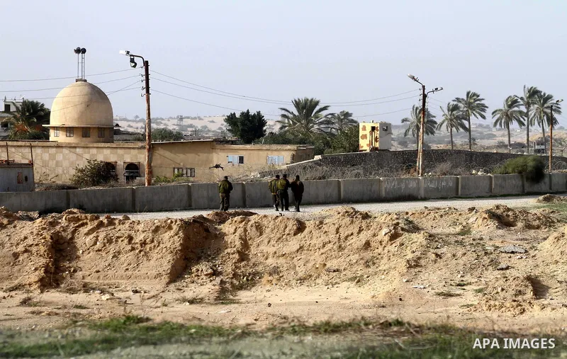Palestinian security forces stand guard near the Egyptian border with the Gaza Strip in the city of Rafah, southern Gaza Strip on, 29 January 2011. The embattled Mubarak tapped Egypt's military intelligence chief as his...