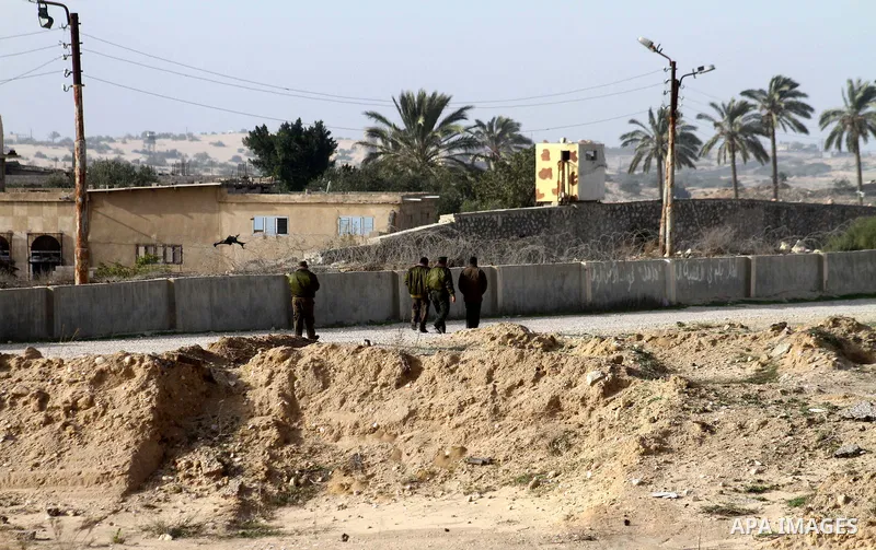 Palestinian security forces stand guard near the Egyptian border with the Gaza Strip in the city of Rafah, southern Gaza Strip on, 29 January 2011. The embattled Mubarak tapped Egypt's military intelligence chief as his...