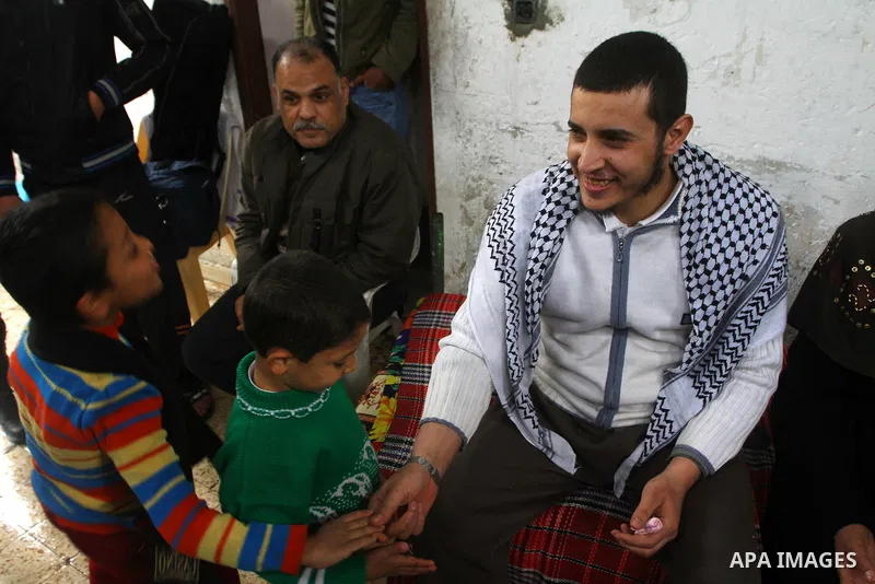 Hassan Weshah a political prisoner arrives to his home after he fled from the prison of Abu Zaabal in Egypt, in the Bureij refugee camp , Sunday, Jan. 30 , 2011. Photo by Ashraf Amra