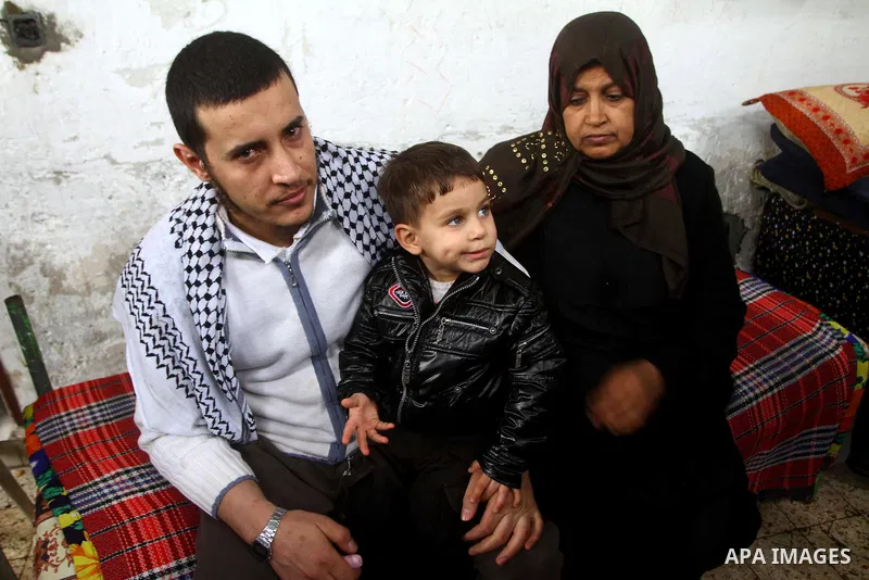 Hassan Weshah a political prisoner arrives to his home after he fled from the prison of Abu Zaabal in Egypt, in the Bureij refugee camp , Sunday, Jan. 30 , 2011. Photo by Ashraf Amra