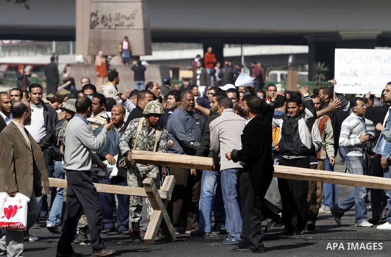 Egyptian demonstrators take part in a protest in Cairo, Egypt, Sunday, Jan. 30, 2011. Photo by STR