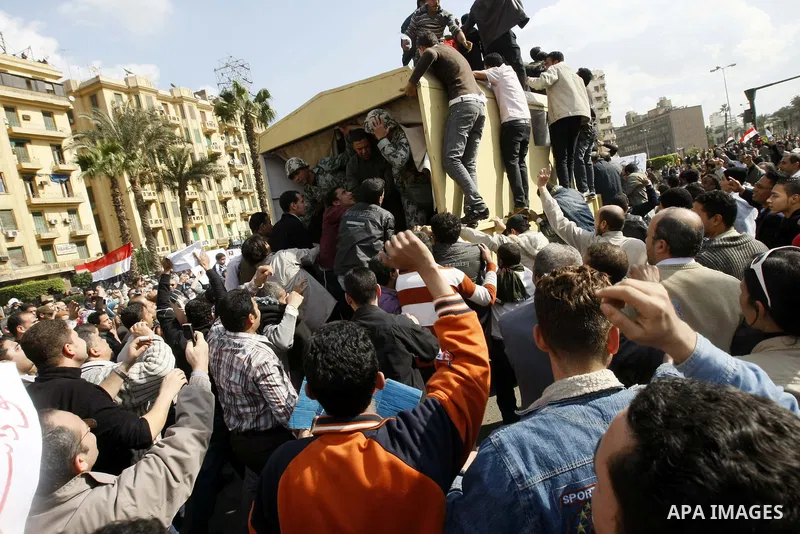 Egyptian demonstrators take part in a protest in Cairo, Egypt, Sunday, Jan. 30, 2011. Photo by STR