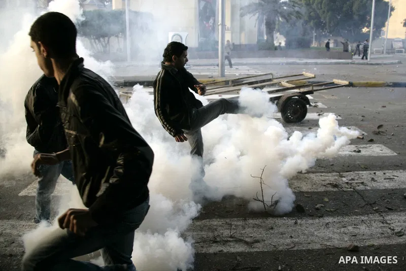 Egyptian policemen fire tear gas canisters towards demonstrators during a protest in Cairo, Egypt, Friday, Jan. 28, 2011. Photo by Karam Nasser
