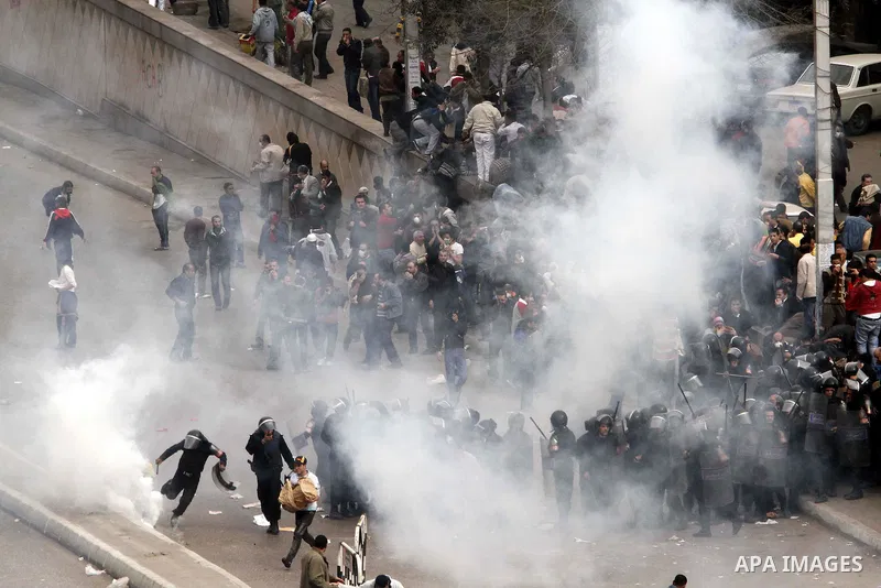 Egyptian policemen fire tear gas canisters towards demonstrators during a protest in Cairo, Egypt, Friday, Jan. 28, 2011. Photo by Karam Nasser