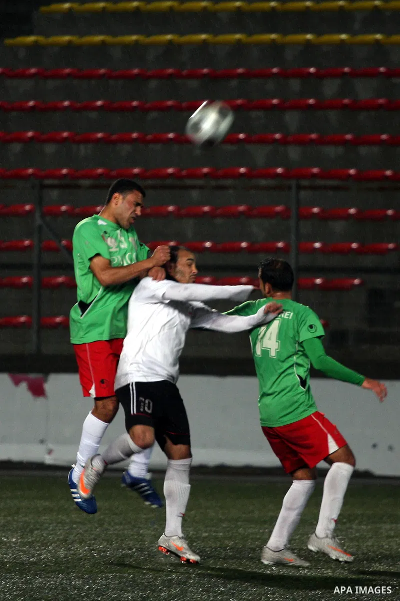Palestinians play a football match between Mukaber Mountain club and Amari camp club in the occupied West Bank on Feb. 1,2011. Photo by Issam Rimawi