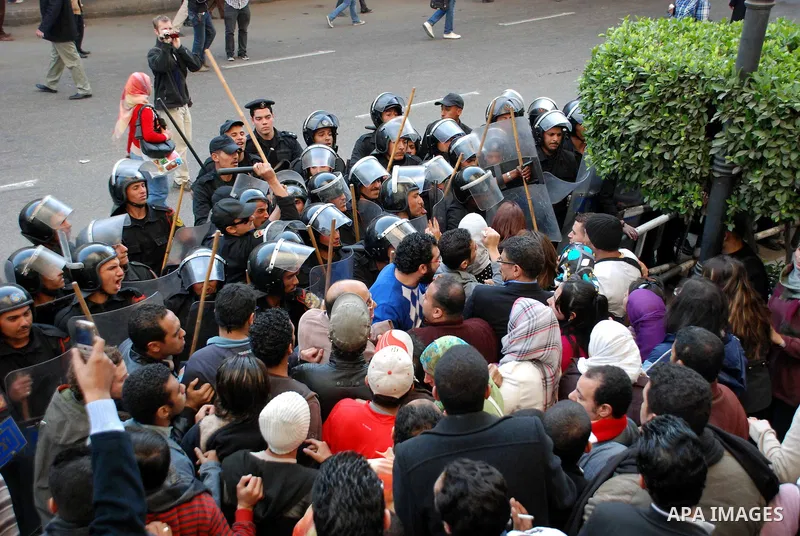 Anti-government protesters scuffle with Egyptian policemen in Tahrir, or Liberation Square in Cairo, Egypt, Jan. 27, 2011. Photo by Ahmed Asad