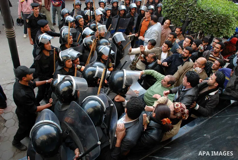 Anti-government protesters scuffle with Egyptian policemen in Tahrir, or Liberation Square in Cairo, Egypt, Jan. 27, 2011. Photo by Ahmed Asad