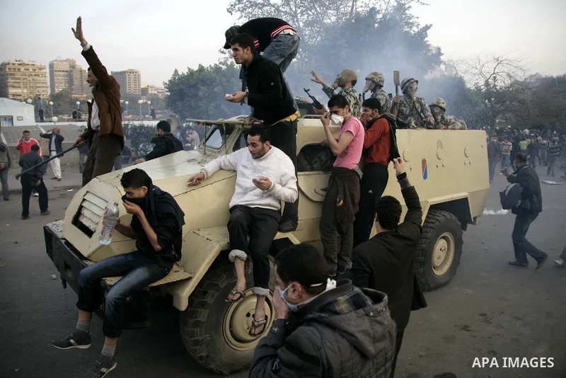 Egyptian policemen fire tear gas canisters towards anti-government protesters during a demonstration against president Hosni Mubarak regime in Tahrir, or Liberation Square in Cairo, Egypt, Jan. 29, 2011. Photo by Karam N...