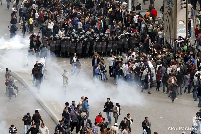 Egyptian policemen fire tear gas canisters towards anti-government protesters during a demonstration against president Hosni Mubarak regime in Tahrir, or Liberation Square in Cairo, Egypt, Jan. 29, 2011. Photo by Karam N...