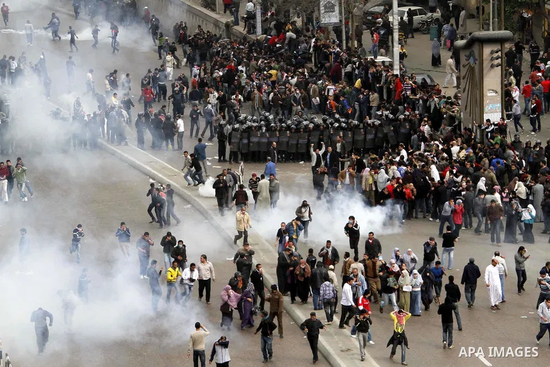 Egyptian policemen fire tear gas canisters towards anti-government protesters during a demonstration against president Hosni Mubarak regime in Tahrir, or Liberation Square in Cairo, Egypt, Jan. 29, 2011. Photo by Karam N...