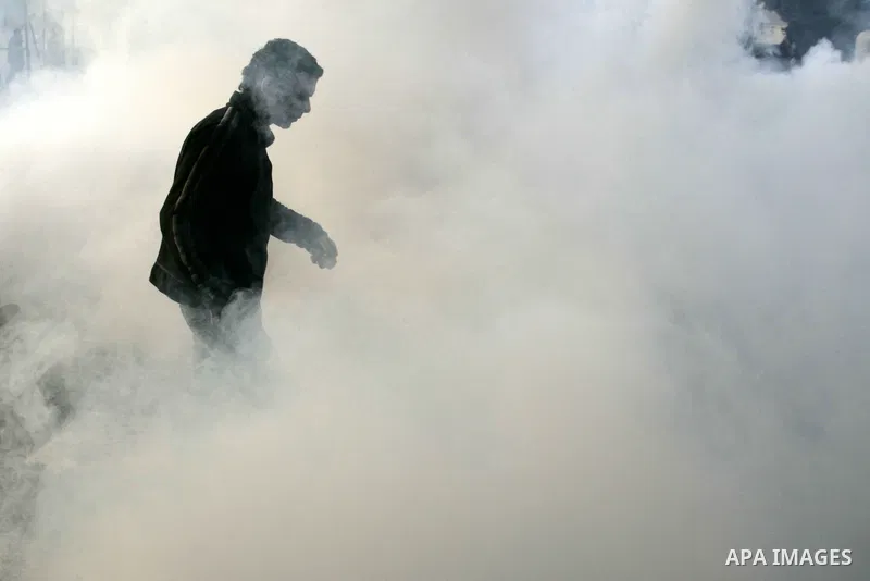 Egyptian policemen fire tear gas canisters towards anti-government protesters during a demonstration against president Hosni Mubarak regime in Tahrir, or Liberation Square in Cairo, Egypt, Jan. 29, 2011. Photo by Karam N...