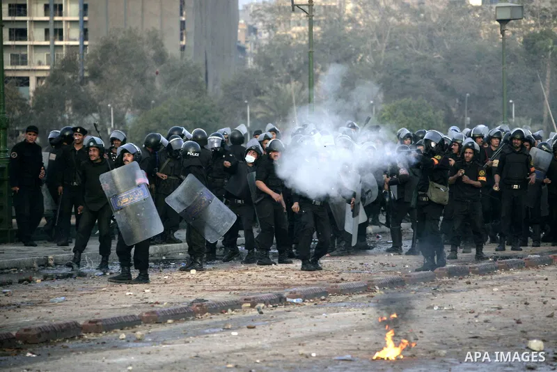Egyptian policemen fire tear gas canisters towards anti-government protesters during a demonstration against president Hosni Mubarak regime in Tahrir, or Liberation Square in Cairo, Egypt, Jan. 29, 2011. Photo by Karam N...