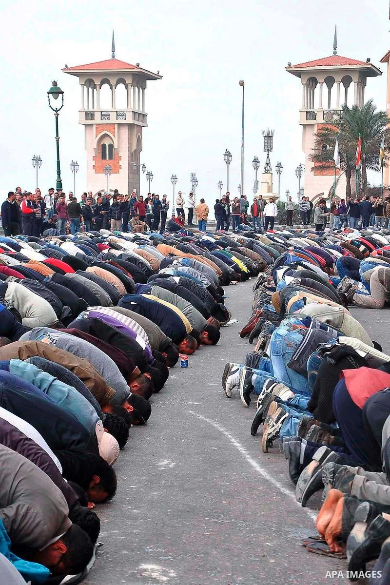 Anti-government demonstrators pray during a march in Alexandria, Egypt, Jan. 28, 2011. Egyptian President Hosni Mubarak defied a quarter-million protesters demanding he step down immediately, announcing he would serve ou...