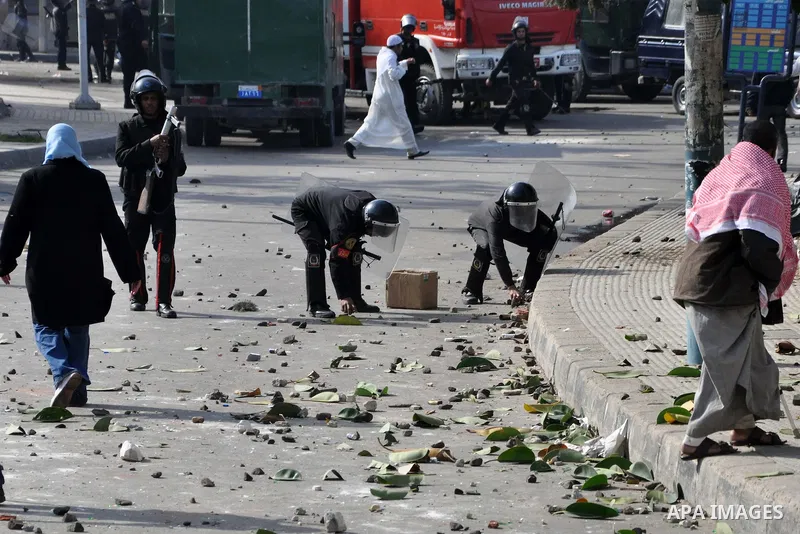 Egyptian police stand guard during fresh demonstrations that erupted following Friday prayers in Alexandria, Egypt, Jan. 28, 2011. Violent clashes marked a 'Friday of rage' in Egypt, as anti-government protesters sought...