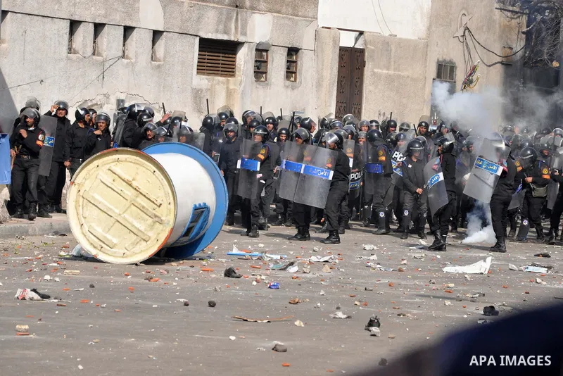 Egyptian police stand guard during fresh demonstrations that erupted following Friday prayers in Alexandria, Egypt, Jan. 28, 2011. Violent clashes marked a 'Friday of rage' in Egypt, as anti-government protesters sought...