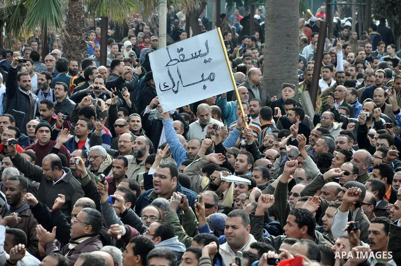 Anti-government demonstrators march in Alexandria, Egypt, Jan. 28. 2011. Egyptian President Hosni Mubarak defied a quarter-million protesters demanding he step down immediately, announcing he would serve out the last mon...
