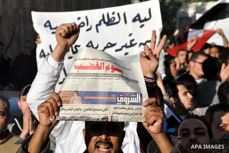 Anti-government demonstrators take part in a protest in Alexandria, Egypt, Jan. 25, 2011. Egyptian President Hosni Mubarak defied a quarter-million protesters demanding he step down immediately, announcing he would serve...