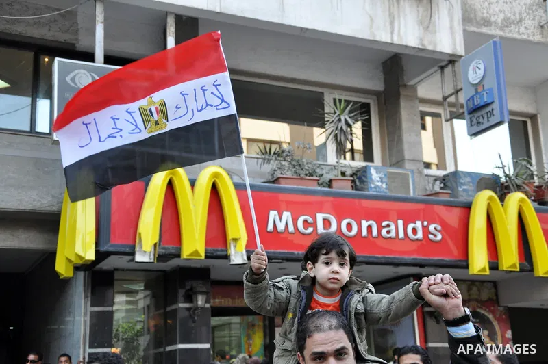 Anti-government demonstrators take part in a protest in Alexandria, Egypt, Jan. 25, 2011. Egyptian President Hosni Mubarak defied a quarter-million protesters demanding he step down immediately, announcing he would serve...