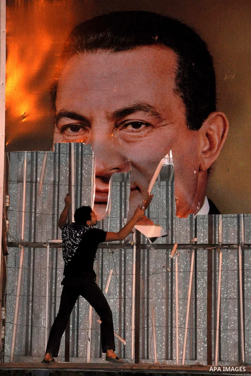 Anti-government demonstrators take part in a protest in Alexandria, Egypt, Jan. 25, 2011. Egyptian President Hosni Mubarak defied a quarter-million protesters demanding he step down immediately, announcing he would serve...