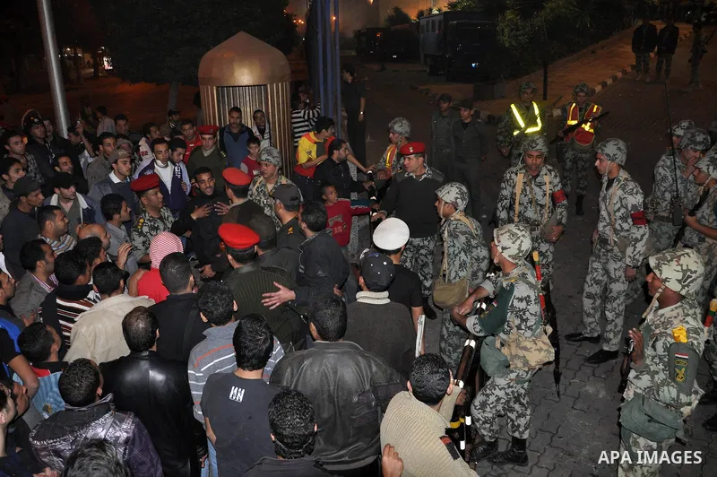 Egyptian protesters are gathered a round Egyptian army soldiers after demonstrations which erupted following Friday prayers, in Alexandria, Egypt, 28 January 2011. Violent clashes marked a 'Friday of rage' in Egypt, as a...
