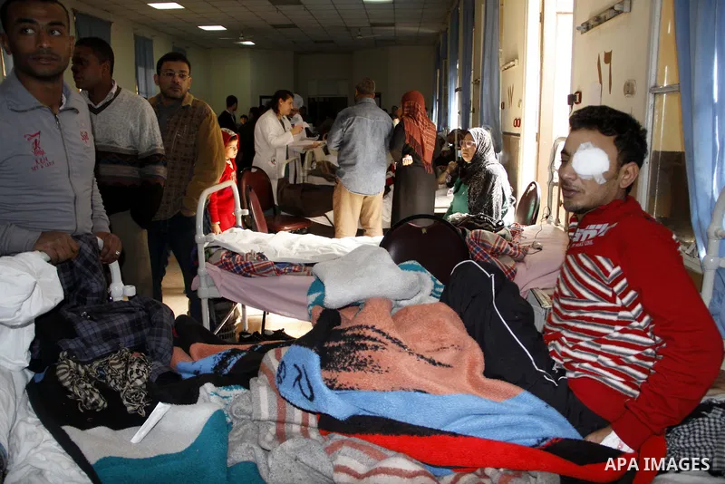 A wounded protester is being treated after being injured during clashes in Cairo's main square, Egypt, Thursday, Feb. 3, 2011. Egyptian army tanks and soldiers moved to end violence between anti-government protesters and...