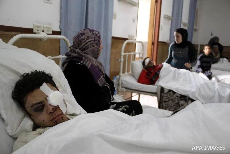A wounded protester is being treated after being injured during clashes in Cairo's main square, Egypt, Thursday, Feb. 3, 2011. Egyptian army tanks and soldiers moved to end violence between anti-government protesters and...