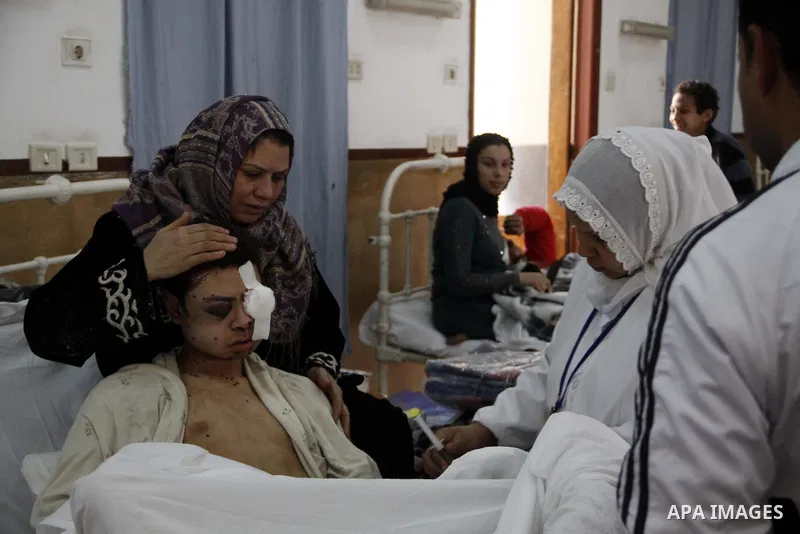 A wounded protester is being treated after being injured during clashes in Cairo's main square, Egypt, Thursday, Feb. 3, 2011. Egyptian army tanks and soldiers moved to end violence between anti-government protesters and...