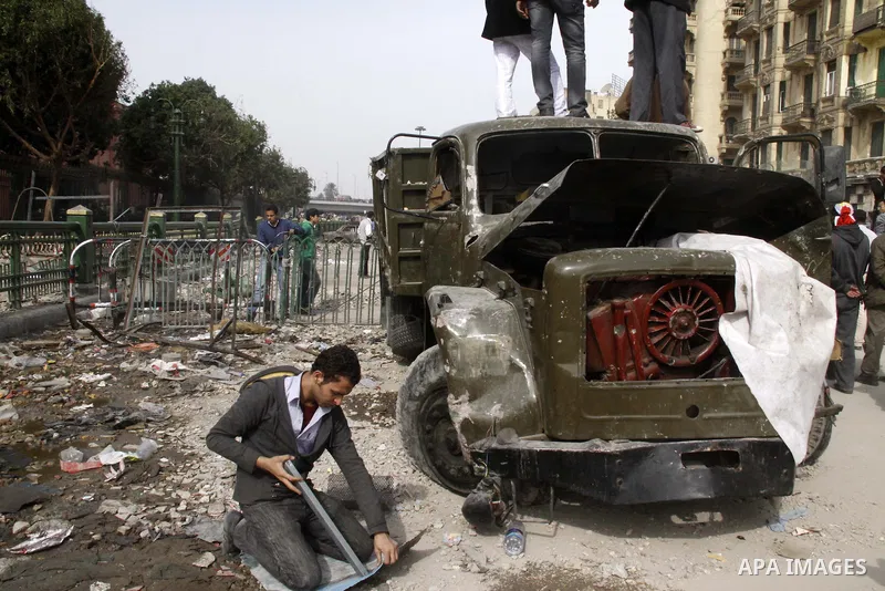 Anti-government protestors take part in a protest in Cairo's main square, Egypt, Thursday, Feb. 3, 2011. New clashes are heating up again and shots are being fired in the air around Cairo's central Tahrir Square as anti-...