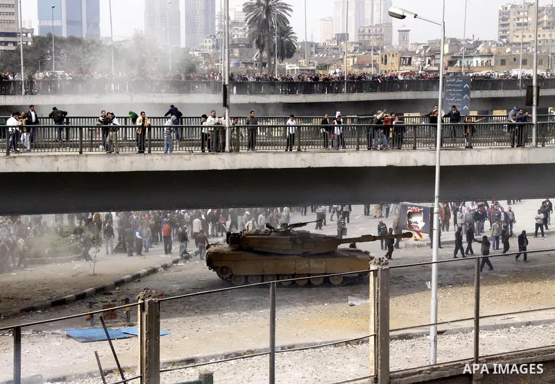 Anti-government protestors take part in a protest in Cairo's main square, Egypt, Thursday, Feb. 3, 2011. New clashes are heating up again and shots are being fired in the air around Cairo's central Tahrir Square as anti-...