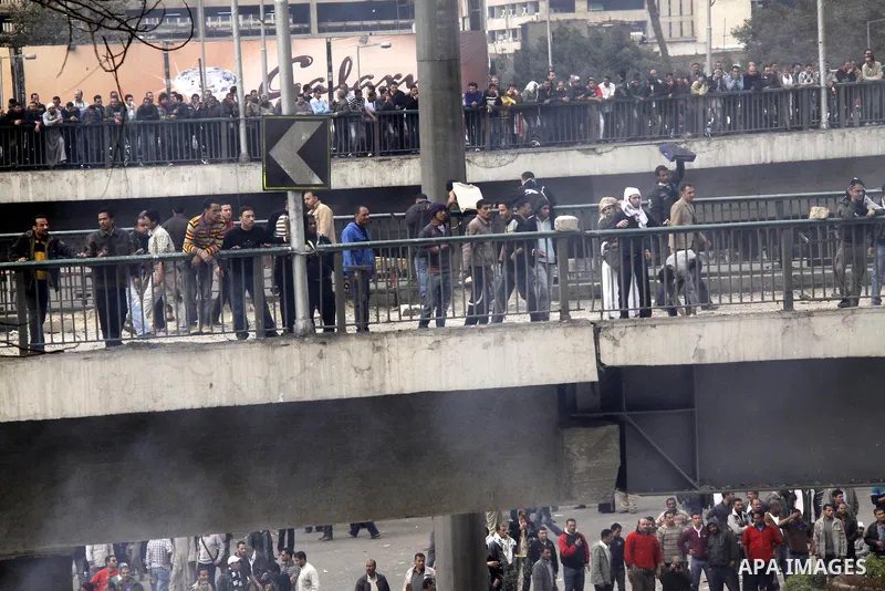 Anti-government protestors take part in a protest in Cairo's main square, Egypt, Thursday, Feb. 3, 2011. New clashes are heating up again and shots are being fired in the air around Cairo's central Tahrir Square as anti-...