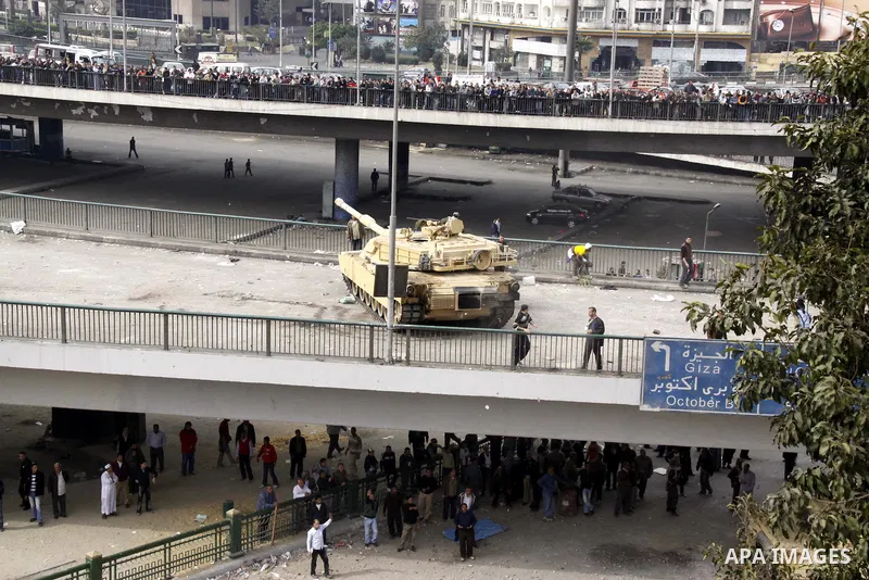 Anti-government protestors take part in a protest in Cairo's main square, Egypt, Thursday, Feb. 3, 2011. New clashes are heating up again and shots are being fired in the air around Cairo's central Tahrir Square as anti-...