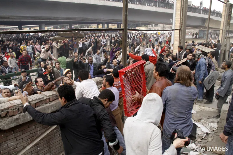 Anti-government protestors take part in a protest in Cairo's main square, Egypt, Thursday, Feb. 3, 2011. New clashes are heating up again and shots are being fired in the air around Cairo's central Tahrir Square as anti-...